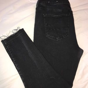 American eagle black jeans frayed bottoms.